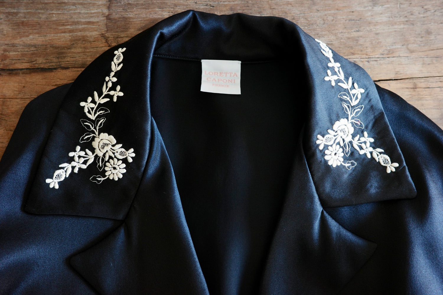 Detail shot of an embroidered collar on a black shirt