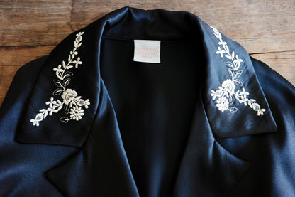 Detail shot of an embroidered collar on a black shirt