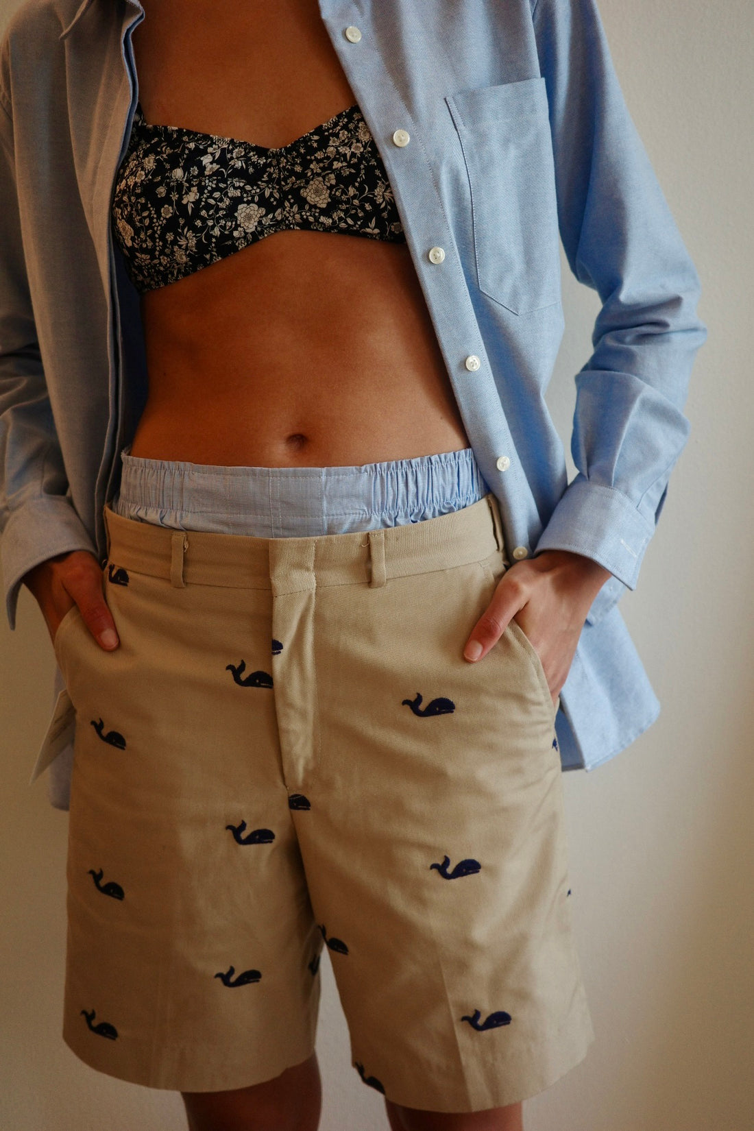 Torso wearing floral bra and shorts